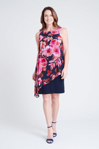 woman-wearing-connected-apparel-Amelia Fuchsia Floral Print Dress-posing-on-plain-background